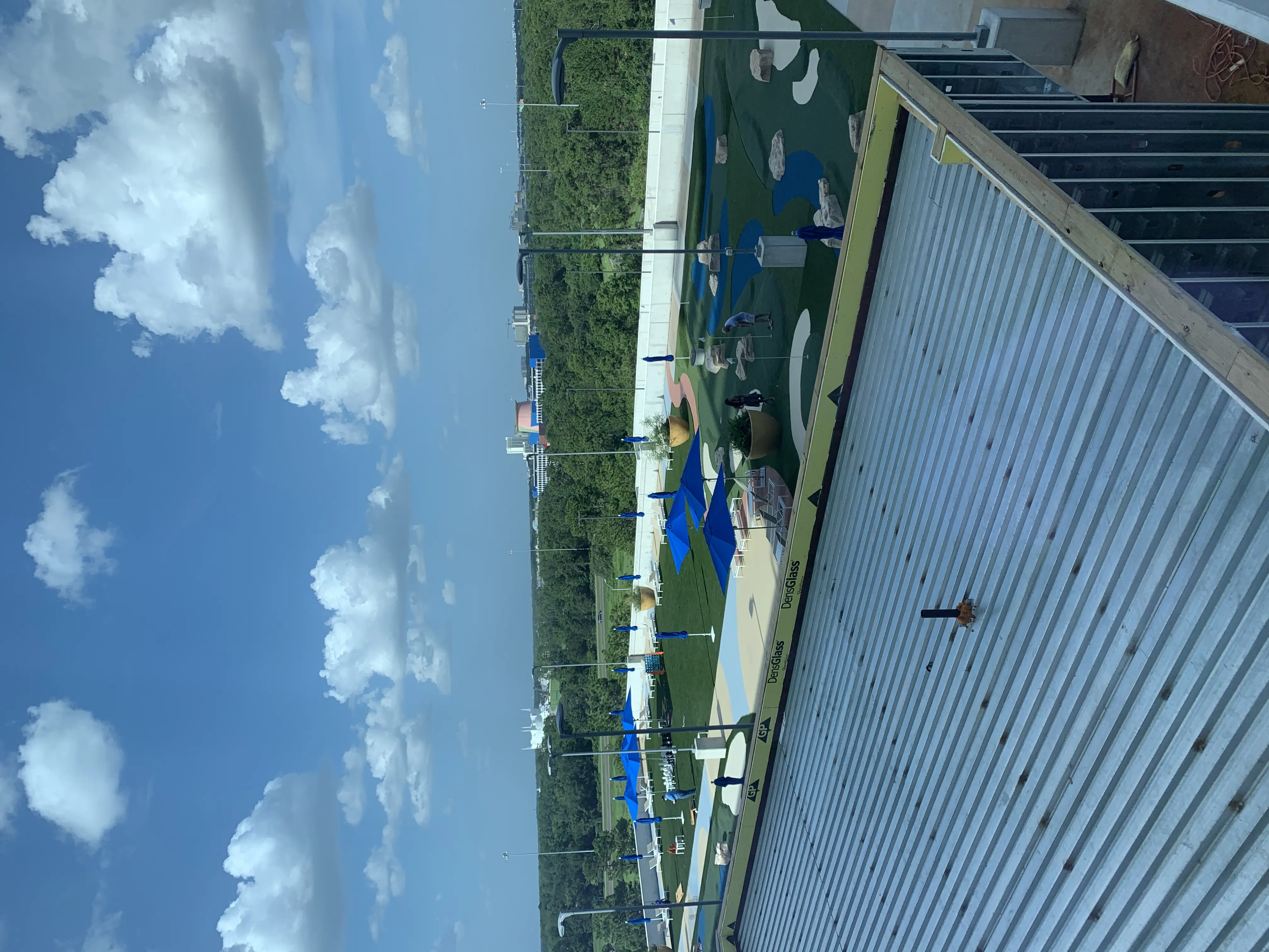 a view of a park from a roof