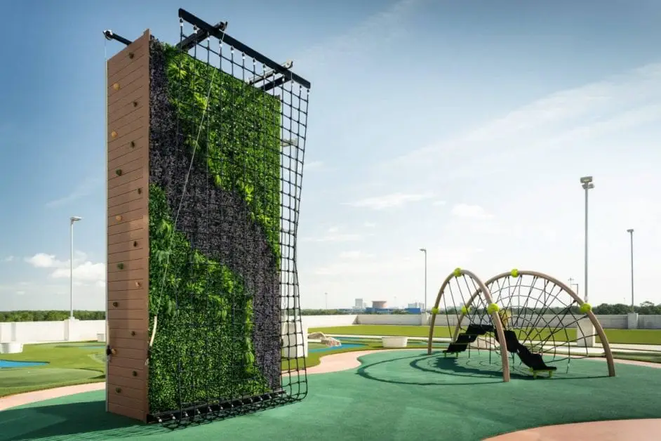 a playground with climbing wall and climbing equipment