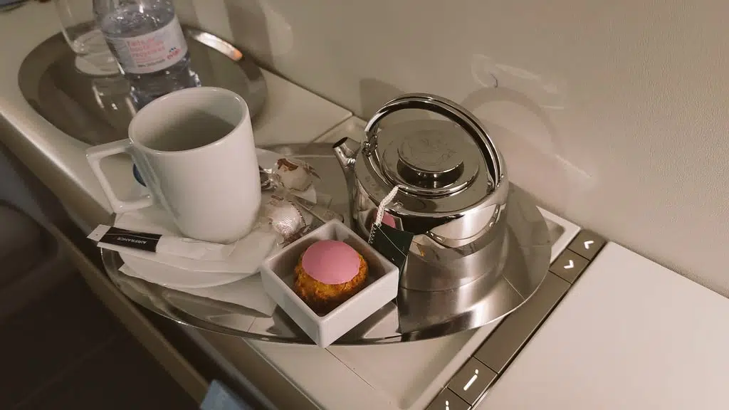 a teapot and cup on a tray