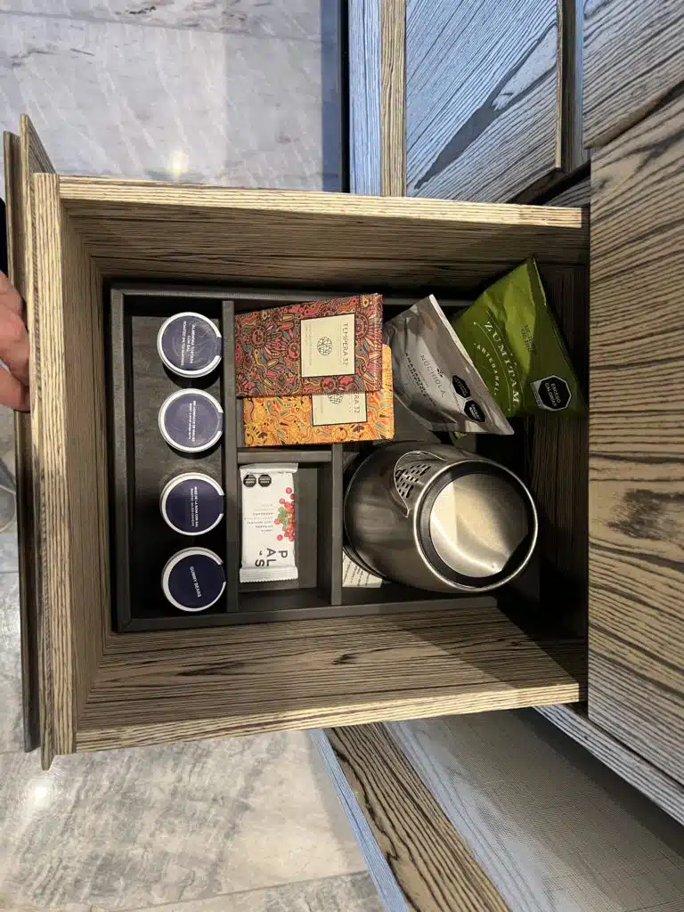 a drawer with a metal container and a metal container