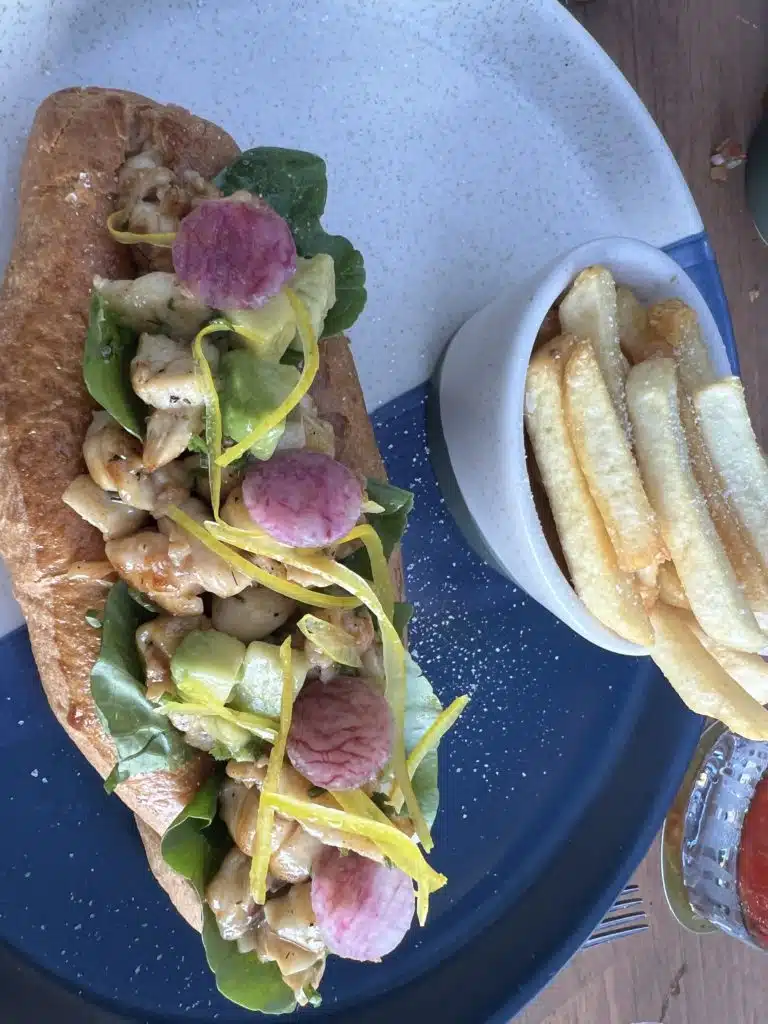 a sandwich with vegetables and meat on a plate