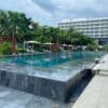 a pool with a building in the background