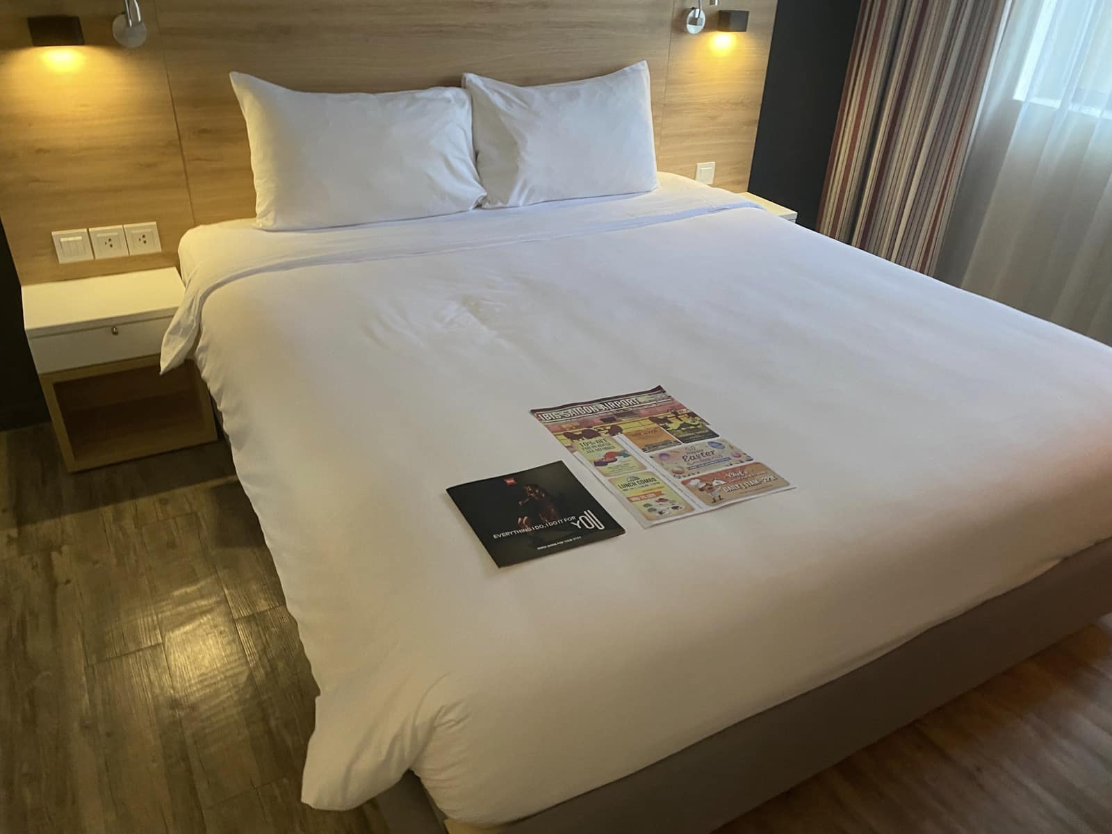 a bed with a magazine on it